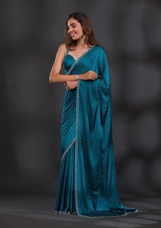 Product Details - Turquoise Blue Saree in Satin fabric - The Saree is elevated with Stonework embroidery - It comes with an Unstitched blouse Size & Fit Saree: 5.5 Mtrs; Blouse: 0.80 Mtrs Material & Care Satin Dry Wash Only Product Category: Saree Fabric: Satin Work: Stonework Color: Turquoise Blue Secondary Work: Swarovski Turquoise Blue Saree, Wedding Wear Saree, Saree Jackets, Saree Party Wear, Saree With Belt, Latest Model Blouse Designs, Usa Women, Saree Poses, Plain Saree