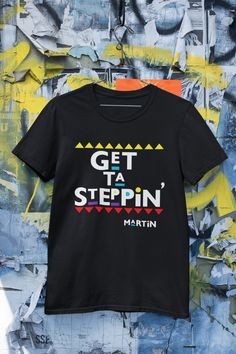 "This design is perfect for any fan of the show Martin or for anyone that wants to tell someone to \"Get ta Steppin\" The unisex heavy cotton tee is the basic staple of any wardrobe. It is the foundation upon which casual fashion grows. All it needs is a personalized design to elevate things to profitability. The specialty spun fibers provide a smooth surface for premium printing vividity and sharpness. No side seams mean there are no itchy interruptions under the arms. The shoulders have tape for improved durability.  .: 100% Cotton (fiber content may vary for different colors) .: Medium fabric (5.3 oz/yd² (180 g/m .: Classic fit .: Tear away label .: Runs true to size .: 100% Airlume combed and ringspun cotton (fiber content may vary for different colors) .: Light fabric (4.2 oz/yd² (142 Martin 90s, Martin Show, 90s Sitcoms, Shirt Ideas, Theme Party, Design Inspo, Cotton Fiber, Heavy Cotton, Cotton Tee