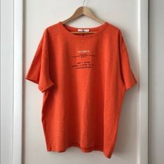 Oversized Men’s Tee Shirt. Super High Quality Tee Shirt From Great Brand. Very Oversized, Fits More Like A Medium Or Large. New With Original Tags, Never Been Worn. 100% Cotton. Reselling Because It’s Not The Best Color On Me. Oversized Orange Summer T-shirt, Drop Shoulder Text Print Tops For Loungewear, Oversized Relaxed Tops With Letter Print, Relaxed Oversized Letter Print Tops, Oversized Orange T-shirt For Streetwear, Casual Drop Shoulder Top With Text Print, Trendy Oversized Orange T-shirt, Oversized Trendy Orange Tops, Orange Relaxed Fit Tops For Streetwear