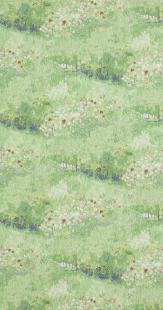 a green wallpaper with white and red flowers on the grass in front of it