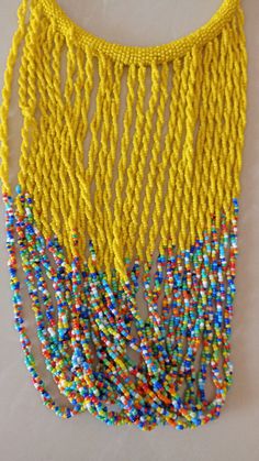 African Fringe Necklace, African Beaded Jewelry, Yellow Beaded Necklace, Tribal Jewelry, Women Necklaces, Mothers Gift, Chunky Jewelry This multi strand necklace is superbly crafted which makes you out stand in any occasion. Main Color - Yellow. Different colors are available. Feel free to send me a convo or e-mail for any clarification or more information. Thank you for visiting, Yellow Beaded Necklace With Large Beads For Beach, Yellow Beaded Bib Necklaces With Round Beads, Yellow Polished Beads For Festivals, Yellow Necklaces With Large Beads For Crafting, Yellow Multi-strand Beaded Necklaces For The Beach, Handmade Yellow Multi-strand Beaded Necklaces, Handmade Multi-strand Yellow Beads, Handmade Yellow Multi-strand Beads, Yellow Beaded Necklaces With Dangling Round Beads