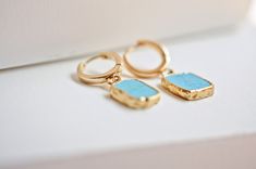 "Shiny turquoise earrings in huggie hoop earrings feature secure and smooth closure, all while adding a dainty pop of color with the turquoise gemstone. Dainty and simple gold hoop earrings, perfect for stacking and layering with your favorite accessories. Add a touch of boho vibe to your Valentines Day Gift selection with our beautiful gold turquoise earrings effortlessly. Inspired by royal blue turquoise gemstone and the simplicity of gold hoop earrings, we've created elegant Bella open hoop e Minimalist Turquoise Hoop Earrings As Gift, Minimalist Turquoise Hoop Earrings For Gifts, Turquoise Round Huggie Earrings For Gift, Turquoise Huggie Earrings For Gift, Elegant Turquoise Huggie Earrings Gift, Turquoise Hoop Huggie Earrings As Gift, Simple Gold Hoop Earrings, Earrings Stacking, Gemstone Hoop Earrings