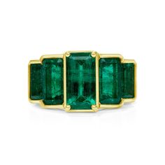 This modern and sleek emerald ring is truly a must-have to add a pop of color for both an everyday or evening look. It consists of 5 emerald cut Zambian emeralds and a bezel set in 18KT yellow gold. Zambian Emeralds are famous for the bluish undertone in color and has a higher clarity and hardness than other emeralds. 5 x 1.27CT Emerald Cut Zambian Emeralds 18KT Yellow Gold Luxury Bezel-set Open Emerald Ring, Timeless Bezel-set Emerald Cut Emerald Ring, Luxury Octagon Emerald Ring With Bezel Setting, Bezel Set Baguette Cut Emerald Ring, Emerald Baguette Cut Ring With Bezel Setting, Luxury Emerald Baguette Cut Bezel Set Ring, Formal Emerald Ring With Rectangular Stone And Bezel Setting, Luxury Emerald Cut Ring With Bezel Setting, Luxury Emerald Cut Emerald Ring With Bezel Setting