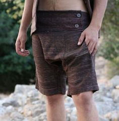 Handmade men's Raw Silk Harem shorts. Two side pockets  Elastic waist. Decorative front part with two buttons. These amazing handmade Raw Silk shorts are a perfect item for relaxed lifestyle. this casual outfit is soft, light and pleasant to wear .  COLORS Brown SIZING Waist circumference: S - 30.7"(78cm) stretch to 35.43"(90cm)*M 32.28"(82cm) stretch to 37.79"(96cm)*L31.49"(80cm) stretch to 38.58"(98cm) Length S 18.5"(47cm) Inner leg 6.69"(17cm) *M 19"/48cm Inner leg 8.26" FABRIC  Raw Silk Coco Mens Boho Large Jean Shorts, Short Cotton Bottoms With Buttons, Summer Brown Bottoms With Hip Pockets, Brown Cotton Knee-length Shorts, Fitted Cotton Shorts With Buttons, Brown Knee-length Shorts With Pockets, Cotton Shorts With Buttons, Fitted Brown Cotton Shorts, Brown Shorts With Side Pockets