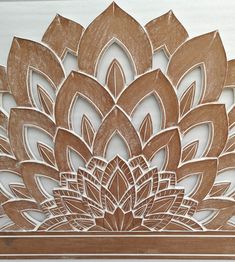 an intricate wooden design on the side of a wall