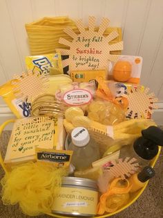 a yellow basket filled with lots of different types of items on top of a carpet