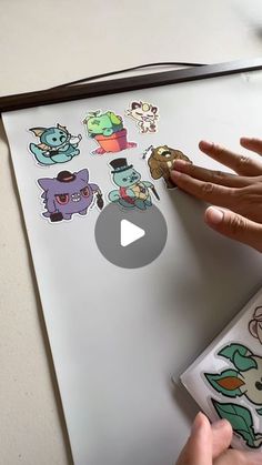 Geoffrey Siu | Enamel Pins on Instagram: "I love sticker books because I am able to peel, stick and reuse stickers in my collection. But what if I want to display them on my wall? I had this idea of using a nonstick baking mat as a reusable sticker display, but I didn’t know how I would mount it to the wall. Then I found magnetic poster displays! The nonstick silicone mats serve as a replacement for a sticker book page, and a perfect alternative for those who have extra large stickers, and like to have the option of using them on another surface in the future. If you’d like to get the same mat and magnetic poster frame, you can find all of my links in my linktree! #stickershop #stickercollection #stickerbook #stickerbomb #amazonfinds" How To Display Sticker Collection, Sticker Collage Display, How To Display Stickers, Sticker Collection Display Ideas, Stickers Collection Display, Sticker Display Ideas, Sticker Display, Sticker Books, Trade Books