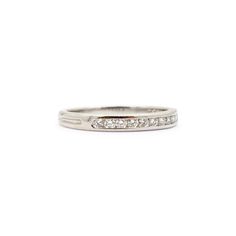 Brand: Tiffany & Co.  Gender: Ladies  Metal Type: Platinum  Size: 6  Shank Maximum Width: 2.50 mm  Weight: 3.00 grams  Ladies 950 platinum diamond wedding band with a half-round shank. Engraved with "PT950".  Pre-owned in excellent condition. Might shows minor signs of wear.  Channel Set in 950 Platinum with:  Eleven (11) round brilliant cut natural diamonds:  Measurements: 1.40mm - 1.50mm in diameter x ~0.88mm in depth. Weight Range: 0.013 ct. - 0.015 ct. Estimated Total Weight: 0.150 ct. Color Classic Bands With Diamond Accents For Promise Ring, Classic Band Ring With Diamond Cut, Classic Bands With Prong Setting For Promise, Classic Band Stackable Wedding Rings, Classic Diamond Cut Band Ring, Classic 14k White Gold Stackable Rings With Diamond Cut, Classic Diamond Cut Stackable Rings In 14k White Gold, Classic Band Rings With Diamond Cut, Classic Wedding Stackable Band Rings