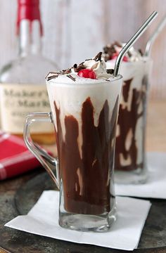 two glasses filled with ice cream and chocolate