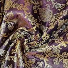 a purple and gold brocaded fabric