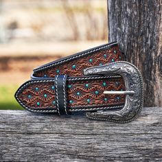 If you're looking for a one-of-a-kind accessory to elevate your outfit, our Turquoise Polka Hand Tooled Leather Western Belt is just what you need. Made with genuine leather and a custom hand-tooled design, this western belt is both stylish and durable. The turquoise polka dots add a pop of color and personality to any outfit, making it perfect for women who want to make a fashion statement. Our custom leather belt is carefully crafted by skilled artisans, ensuring the highest quality and attent Blue Flower Design, Custom Leather Belts, Tooled Leather Belts, Handmade Leather Belt, Western Accessories, Western Belt, Tool Belt, Hand Tooled Leather, Western Belts