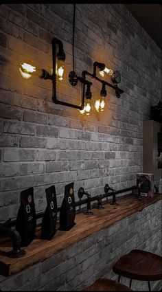 a brick wall with lights hanging from it