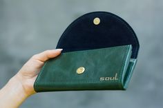 Comfortable leather wallet with magnetic button. The wallet has 2 sections for banknotes, 2 sections for cards and a pocket with a lock. Height: 3.5 inches (9 cm) Width: 7.1 inches (18 cm) Depth: 1.2 inches (3 cm) Thanks for visiting our store :-) Green Wallets With Card Slots As A Gift, Green Leather Coin Purse For Gift, Green Wallets With Card Slots For Gift, Green Rectangular Wallet For Gift, Green Rectangular Wallet Gift, Green Bag With Card Slots As Gift, Green Bags With Card Slots As Gift, Green Bags With Card Slots For Gifts, Green Leather Coin Purse With Card Slots