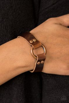 Shiny strips of brown leather loop around a shimmery copper hoop, creating an urban centerpiece. Features an adjustable snap closure. Sold as one individual bracelet. P9UR-CPXX-022XX Luxury Leather Bracelets With Brass Hardware, Cheap Trendy Leather Bracelet For Parties, Luxury Waxed Leather Bracelet, Cheap Casual Brown Leather Bracelet, Leather Wristbands Wrap, Adjustable Rivet Bracelets, Luxury Leather Bracelet With Waxed Finish, Luxury Handmade Leather Bracelet, Luxury Brown Leather Bracelet