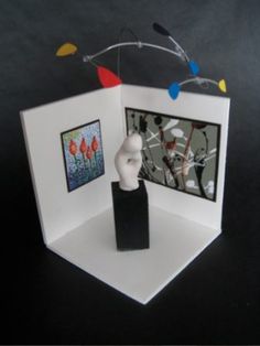 an open card with a sculpture in it