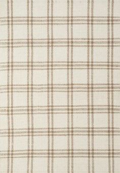 a brown and white plaid pattern on fabric