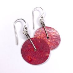 "Hammered copper earrings with sterling wire wraps and earwires. The color on the copper is due to the Flame-patina, which is a spontaneous process and allows for an array of red/orange colors patterns, no two are exactly alike. This rich red goes so well dark hair. 1\" diameter Sterling silver ear wires" Rust Hand Forged Earrings As Gift, Hand Forged Rust Earrings As Gift, Unique Rust-colored Earrings With Ear Wire, Unique Rust Earrings With Ear Wire, Artisan Red Copper Earrings, Artisan Rust-colored Nickel-free Earrings, Hand Forged Rust-colored Unique Earrings, Adjustable Rust Earrings With Ear Wire, Nickel-free Red Copper Earrings