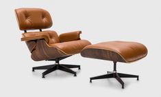 the eames chair and ottoman is shown in brown leather