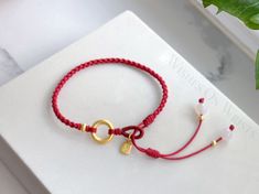 Red Symbolic Handmade Bracelets, Red Braided Bracelet For Good Luck, Elegant Handmade Red Charm Bracelet, Red Spiritual Charm Bracelet, Red Lucky Bracelet, Protection Blessing, Peace Meaning, Red Bracelet, Red String Bracelet