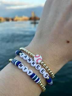 three bracelets with words on them that say yankees and i love you in different languages