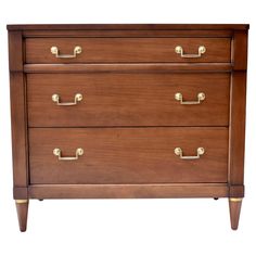 a wooden dresser with three drawers and brass handles