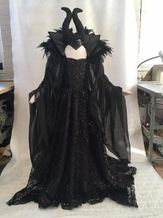 a black dress with feathers on it