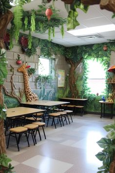 an animal themed classroom with giraffes on the wall and tables in front of them