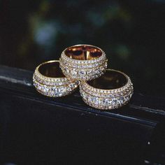 GLD's 5 Layer Diamond Band Ring is flooded in hand-placed stones. Each layer draws attention to its larger center stones, making it the perfect complimentary piece to any of our iced out products. The ring is made up of 100% precious metals made from 925 Silver covered in 3 microns of 18k gold. This product is guaranteed for life – GLD will repair or replace the item should you experience any defects in craftsmanship or breakage. Don't know your ring size? Review our sizing chart below to find y Cross Earrings Studs, Diamond Band Ring, Cross Chain, Vs Diamond, Star Bracelet, Mens Accessories Jewelry, Diamond Rings Bands, Diamond Band, Chain Earrings