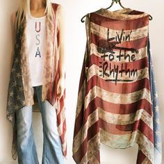 "Vintage looking American Flag, Red White and Blue \"Livin' to the Rhythm\" semi sheer vest- A perfect accessory for the 4th of July, music festivals or anytime, it always looks great.  Super lightweight, semi sheer perfect for hot summer days or nights. Can be ordered with or without \"Livin' to the Rhythm\" choose in drop down when checking out. One size fits most Because the arm holes are larger and the front stays open it does work great for a wide variety of sizes and body types.   Approx. Spring Concert Sleeveless Vest, Sleeveless Vest For Spring Concert, Red Sleeveless Top With American Flag, Sleeveless Red Top With American Flag, Patriotic Flag Print Tank Top For Memorial Day, Independence Day Flag Print Sleeveless Tank Top, American Flag Sleeveless Tank Top For 4th Of July, Patriotic American Flag Tank Top For Independence Day, American Flag Sleeveless Tank Top For Summer