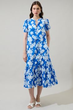 Keep it fun and cute in this adorable floral midi dress. This dress has a button up at the front, a drawstring waist and a cute blue floral print. Pair it with cute sandals or heels for a complete outfit. - Pockets- Split neck- Adjustable waist- Puffed short sleeves- Color: Blue MulSize + Fit - Model is 5'10" and wearing size XS- Measurements taken from size S - Chest: 20 1/4"- Length: 49" Fabric Self: 100% Cotton, Lining: 97% Polyester 3% Spandex Style Number STD14256P Tiered Midi Dress, Blue Floral Print, Cute Sandals, 80 Dress, Midi Dress With Sleeves, Complete Outfits, Blue Midi Dress, Floral Midi Dress, Ticks