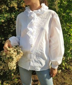 "Stunning vintage collared white blouse. Amazing and cute details. Great vintage condition. One stains at the neck, not noticeable. Material: 35%cotton, 65%polyester, but it feels like cotton when you wear it. Size: Medium size. Please check the measurements. Measurements taken with item laying flat on the ground. Length: 64cm, 25,2\" Chest: 58cm, 22,8\" Hip area: 57cm, 22,4\" Sleeve length from shoulder: 62cm, 24,4\" Will come fresh, ready to be worn right away! Model is 174cm and her size is EU:36(S). For best fit, please compare measurements to an item you already own. I'll ship your package as soon as possible, however, due to the global pandemic, the postal service might take longer than usual to deliver, thank you for your patience! Please feel free contact me if you need additional White Collared Shirt With Lace Collar, White Shirt With Lace Collar, White Collared Feminine Blouse, White Boho Collar Blouse For Spring, White Spring Blouse With Boho Collar, White Blouse With Collar For Spring, White Blouse With Boho Collar For Spring, White Collared Shirt With Ruffles, White Spring Shirt With Lace Collar