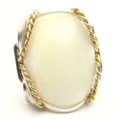 "Vintage Handcrafted Victorian Handmade Wire Wrap Two Tone Sterling Silver/14kt Gold Filled Mother of Pearl Ring Sizing and shipping is ALWAYS FREE with a 14 day \"No Questions Asked\" return policy. Gemstone sizes available: XS (16x12mm 5/8x1/2 inch) S (18x13mm 3/4x1/2 inch 10+ct) M (25x18mm 1x3/4 inch 20+ct) L (30x22mm 11/8 x7/8 inch 25+ct) *In the notes section of your order, please specify ring size and gemstone size (XS-S-M-L).* This ring is made with real gems. I made it myself, so if you Unique White Jewelry With Polished Finish, White Heirloom Jewelry With Polished Finish, Handmade 14k Gold White Rings, Heirloom White Jewelry With Polished Finish, Handmade Heirloom White Gold Jewelry, Handmade Heirloom White Rings, Oval White Wire Wrapped Jewelry, Handmade Oval White Gold Jewelry, Handmade Oval Heirloom Jewelry