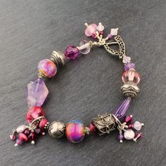 Lampwork Bracelet Sterling Silver, Purple Amethyst, Pink, Beaded Jewelry Bohemian Crystal Bracelet With Czech Glass Faceted Beads, Bohemian Czech Glass Crystal Bracelet With Faceted Beads, Faceted Purple Beaded Bracelets, Silver Amethyst Beaded Bracelets With Faceted Beads, Silver Amethyst Beaded Bracelet With Faceted Beads, Handmade Purple Sterling Silver Beaded Bracelets, Silver Amethyst Beaded Bracelets, Purple Spiritual Bracelets With Faceted Beads, Spiritual Purple Bracelets With Faceted Beads