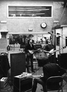 black and white photograph of band playing in recording studio