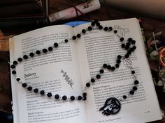 Horned goddess Rosary. Handmade Rosary featuring a black and white acrylic horned goddess charm, silver pentagram, made with black lava beads  Rosary horned goddess necklace Symbolic Black Halloween Necklace, Symbolic Black Necklace For Halloween, Witch Rosary, Horned Goddess, Handmade Rosary, Three Witches, Beads Rosary, Witch Necklace, Beautiful Witch