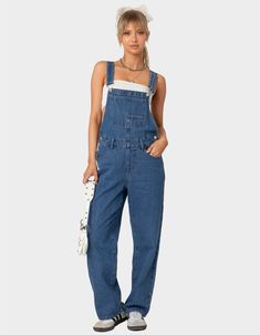 The Denim Craze Continues With These Overalls. These Overalls Are Effortlessly Casual With A Relaxed Fit For That Cool Girl Feel. Overalls. Straight Leg Fit. Button Detailing. Pockets. Belt Loops. 100% Cotton. Model Wears Size S. Model Height Is 5'6. Item Care: Machine Wash At Maximum Of 30ºc, Do Not Bleach, Tumble Dry Low, Iron At A Maximum Of 110ºc, Do Not Dry Clean. | Edikted Rosemary Denim Overalls Cute Overalls, Wwe T Shirts, Flannel Sweatshirt, Girls Overalls, Girls Graphic Tee, Girls Blouse, Sweaters And Jeans, Denim Overalls, Low Iron