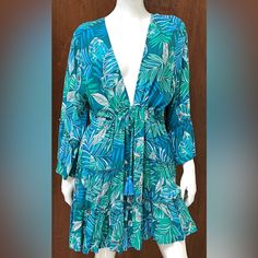 Rayon Blue & Green Blue Long-sleeved Beach Dress, Beachy Blue V-neck Dress, Tropical Blue Beach Dress, Casual Blue Tropical Print Dresses, Flowy Blue Tropical Print Dress, Tropical Blue Dress For Spring, Blue Tropical Print Dress, Blue Tropical Dress For Beach Cover-up, Beachy Blue Dresses With Tropical Print