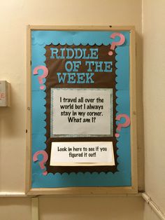 a sign on the wall that says riddle of the week