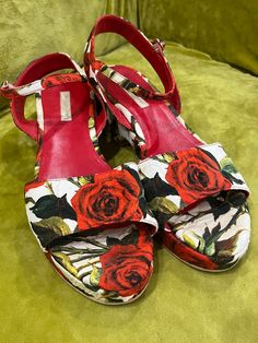 Dolce and Gabbana's fun-spirited vibe is evidently visible in these sandals. This girly and fun pair would complement your dresses and casual separates perfectly. They are crafted from multicolored fabric with beautiful floral prints all over. They feature ankle straps with side buckle fastenings and 5.5 cm high wedge heels. There is small imperfection on front of the platform of left shoe(please see photos). It is visible only from a very close distance. Size 38 Very Good Vintage Condition  Ple Chic Sandals With Floral Print And Open Heel, Chic Floral Print Sandals With Open Heel, Chic Floral Print Open Heel Sandals, Chic Floral Print Ankle Strap Sandals, Designer Multicolor Ankle Strap Sandals, Casual Ankle Strap Sandals With Floral Print, Casual Floral Print Ankle Strap Sandals, Designer Summer Platform Heels, Chic Multicolor Floral Print Sandals