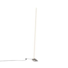 a white floor lamp with a metal base and an electric cord attached to the pole