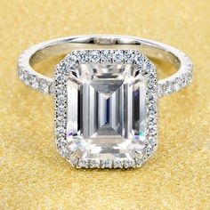 an emerald cut diamond surrounded by diamonds