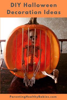 a skeleton in a pumpkin cage sitting on top of a table