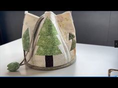 a green and white bag sitting on top of a table