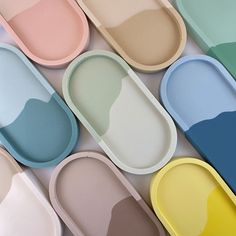 several oval trays with different colors on them