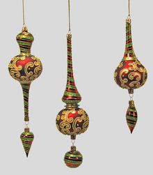 three christmas ornaments hanging from strings on a gray background with gold and red decorations in the shape of balls