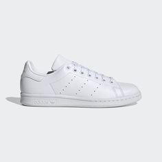 For 50 years, the adidas Stan Smith Shoes have been a staple on the courts and on the streets. Their minimalist style is the very definition of effortless cool. But even icons have to change to stay rooted in the present, which is why this version of the trainers is created with recycled materials. It's part of our effort and commitment to help end plastic waste. This product is made with Primegreen, a series of high-performance recycled materials. 50% of upper is recycled content. No virgin p Elegant Sneakers, Best White Sneakers, Adidas Shoes Superstar, Smith Shoes, White Leather Shoes, Superstars Shoes, Popular Sneakers, Trendy Sneakers, Leather Shoes Woman