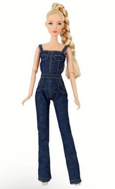 a barbie doll with blonde hair and blue overalls on her body, standing in front of a white background