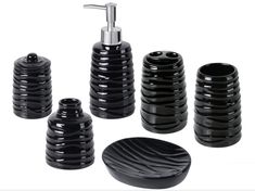 black bathroom accessories including soap dispenser, toothbrush holder and soap dish