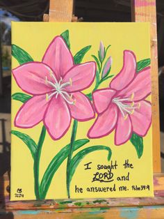 a painting on an easel with pink flowers and the words, i thought the lord and he answered me always