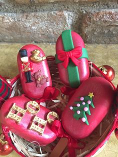 a basket filled with red and green decorated cookies